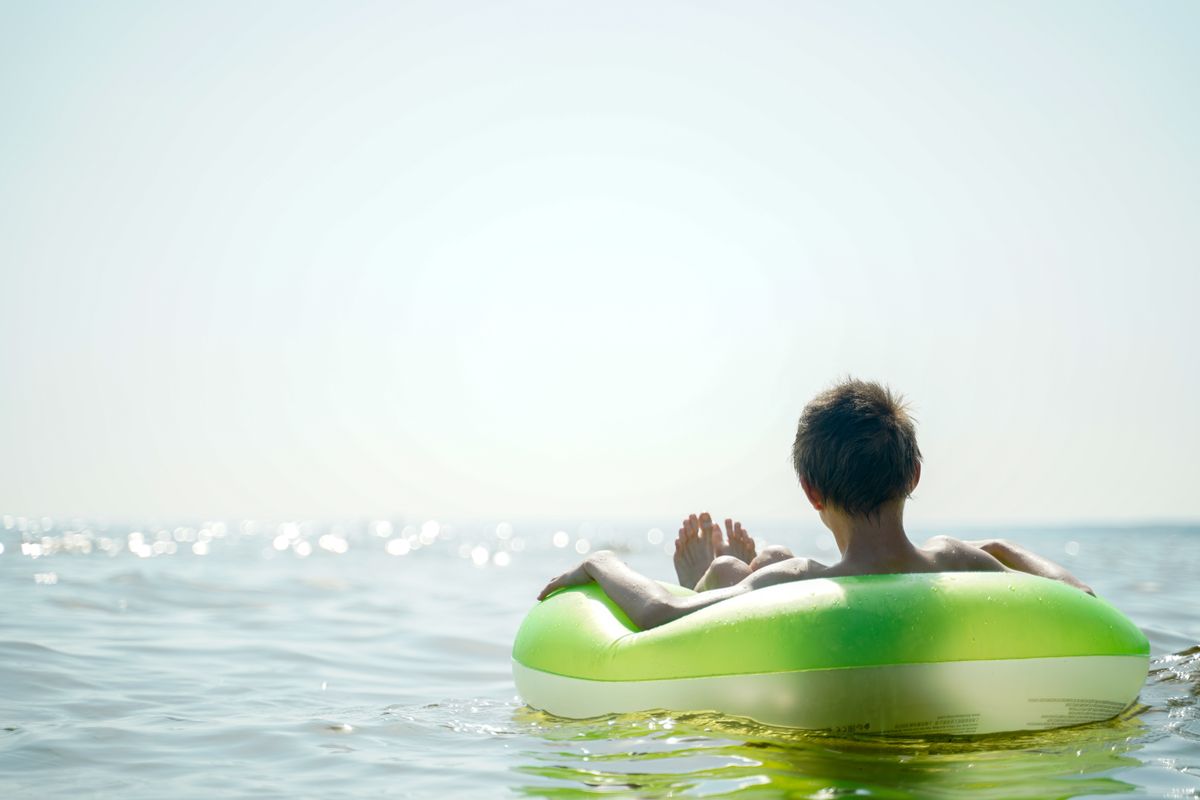 Relaxing on an inflatable in the sea